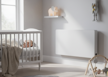 baby sleeping in front of a radiator